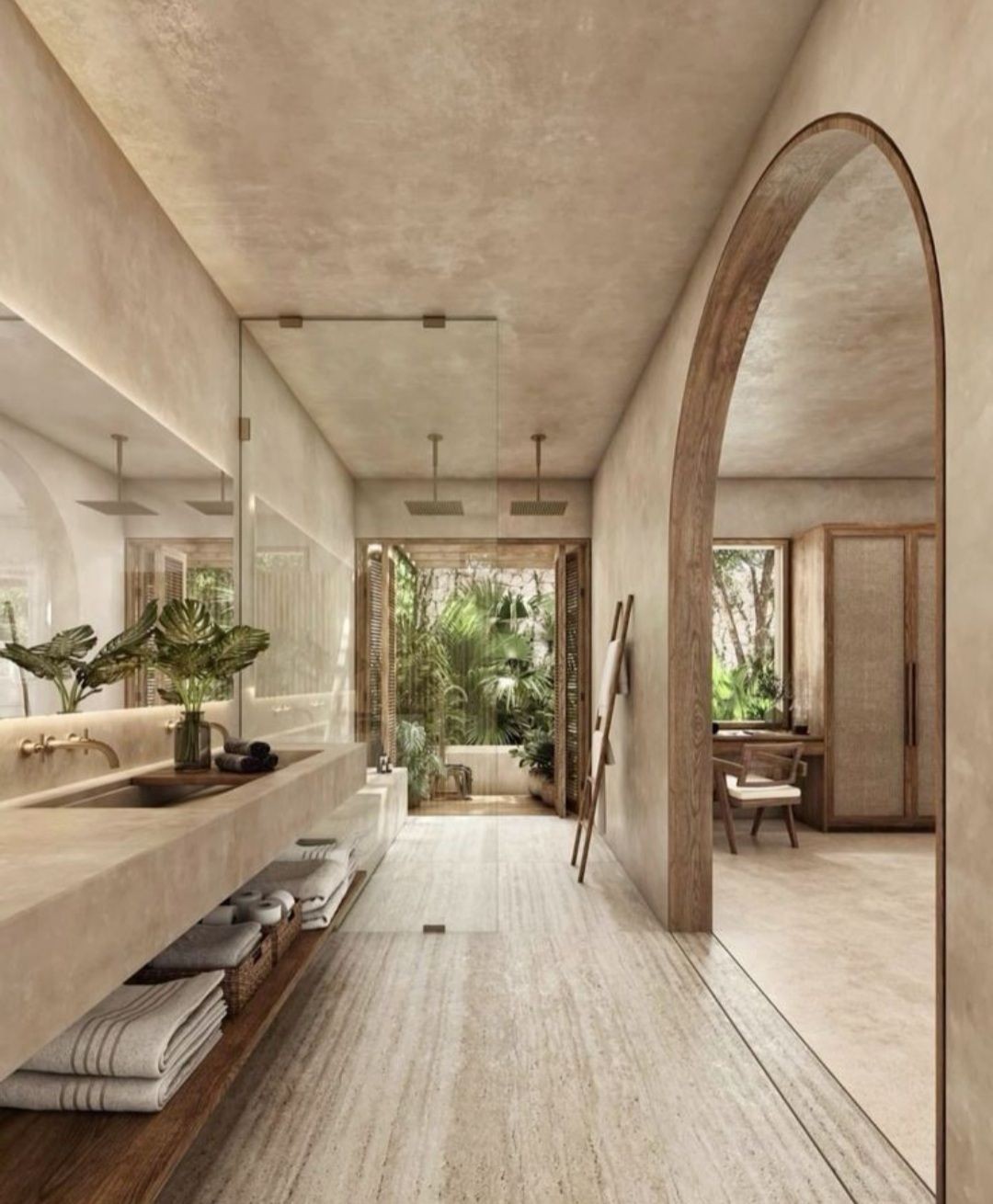 Modern bathroom with natural decor, large mirror, stone countertops, and plants.