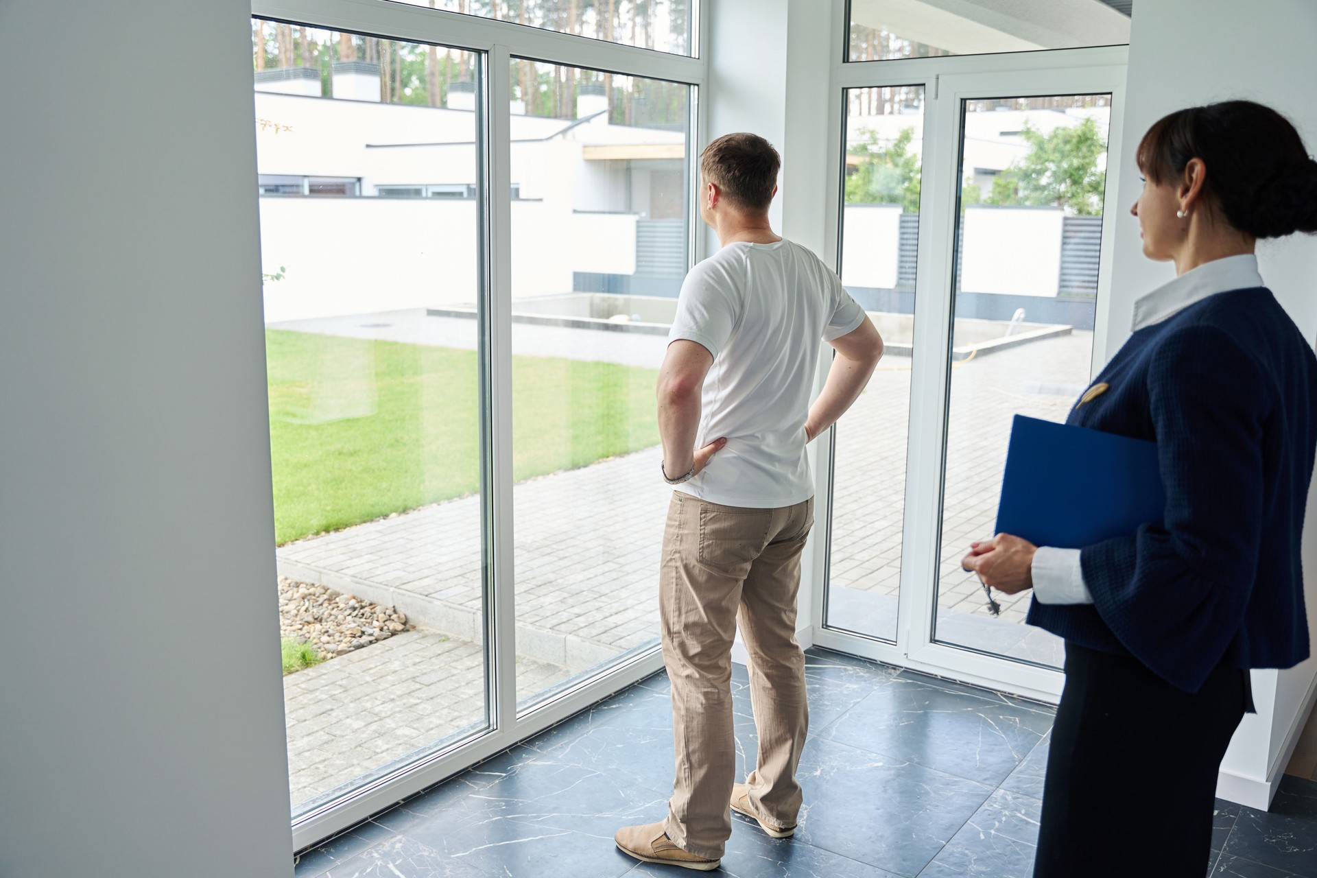 Woman real estate agent shows a house to a buyer