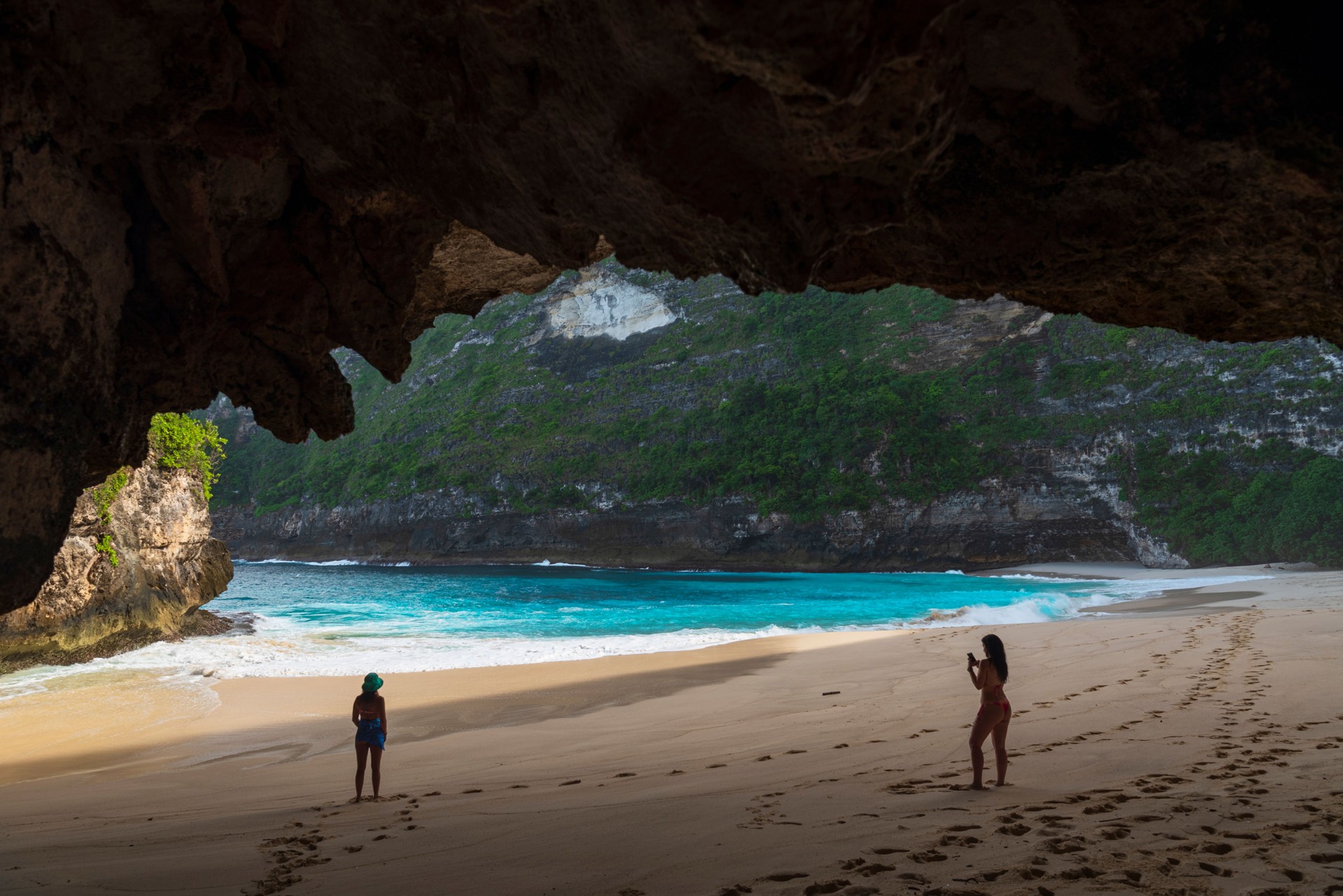 Beutiful girls photographing in the tropical beach, Indonesia