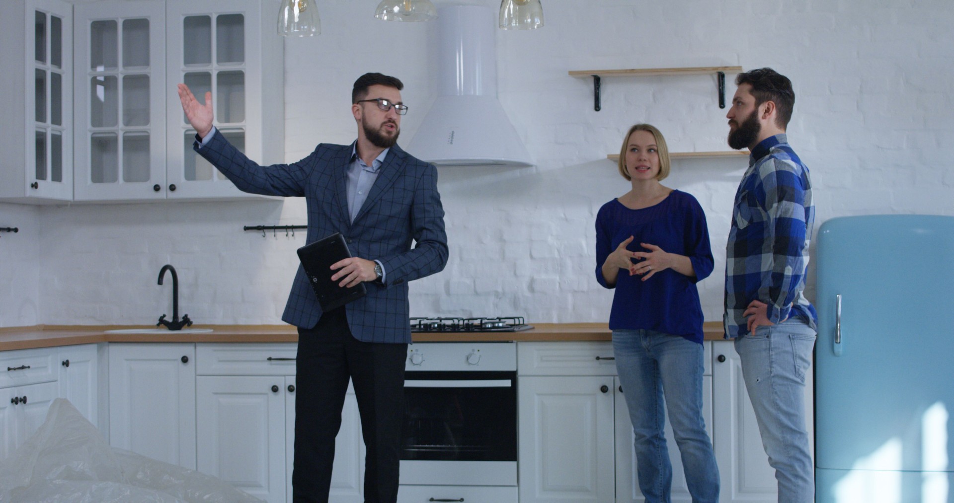 Real estate agent showing property to a couple