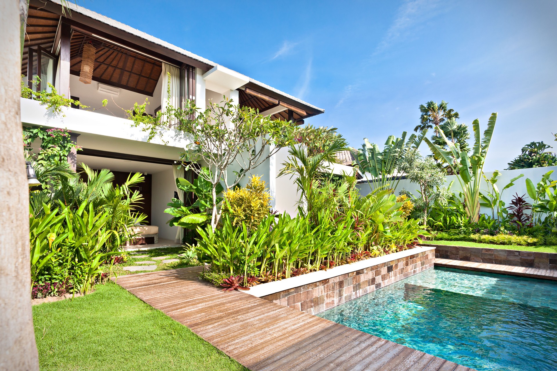 Luxury house with a pool and a garden with lawn